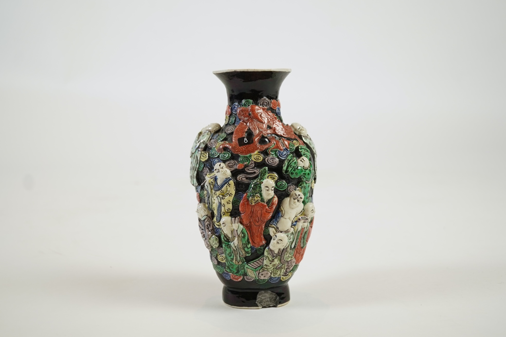 A Chinese enamelled biscuit ‘eighteen Luohan’ vase, 19th century